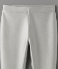 Close-up of light gray pants on a matching gray background